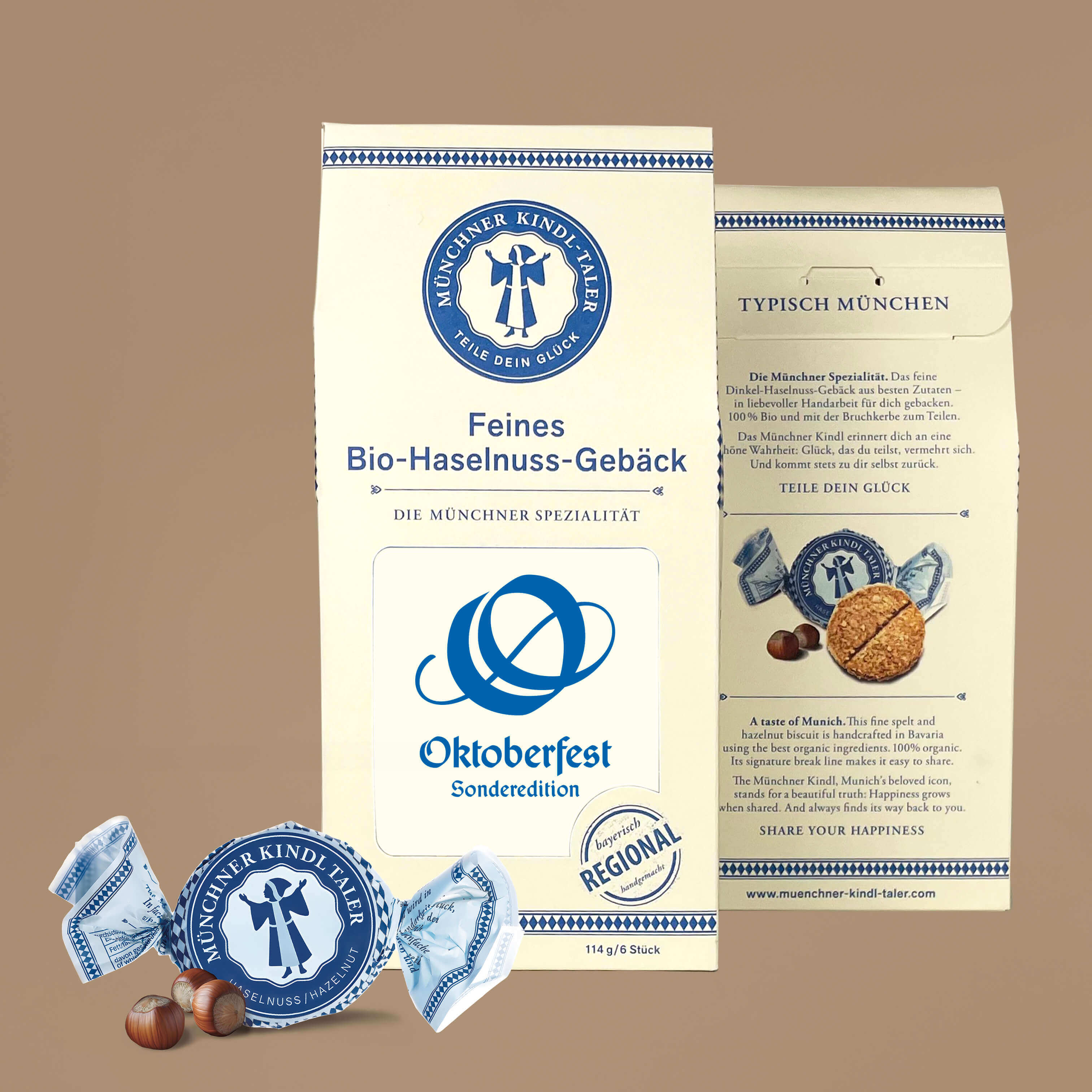 Große cremefarbene Packung mit blauem Text und Inlay Logo Oktoberfest in blau. Sechs einzeln verpackte Münchner Kindl-Taler