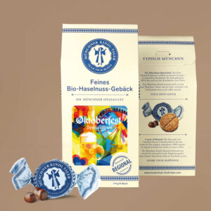 Cremefarbene Packung mit dem Originalmotiv Oktoberfest 2026 von Florian Huber,